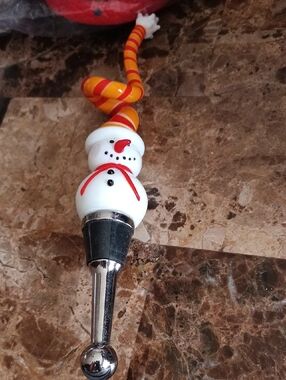 This is a festive LS Arts snowman glass bottle stopper for wine 🍷 🍷 🍷 🍷